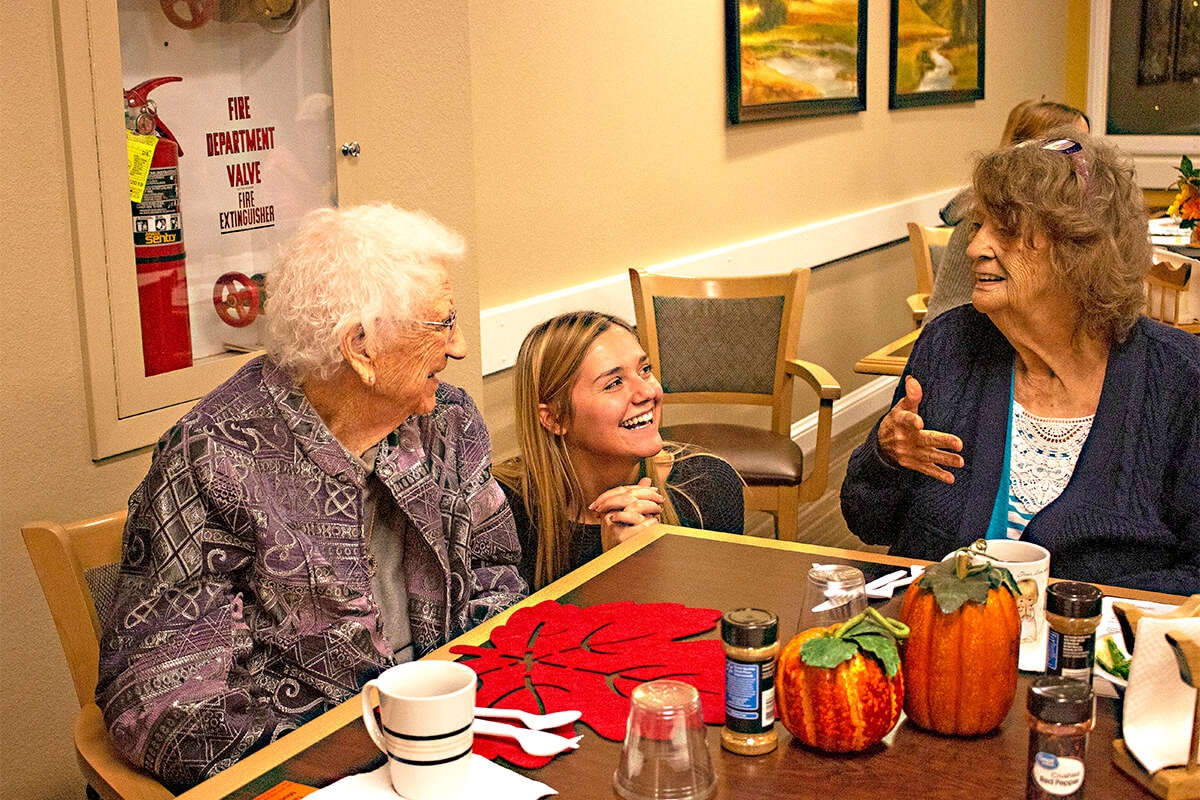 Photo of senior citizens enjoying a meal.