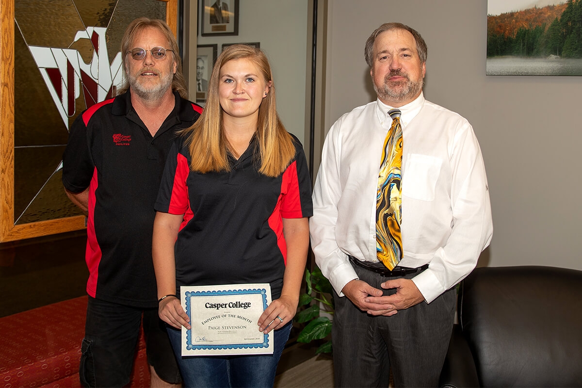 Photo of Paige Stephenson with Mike Svensen left, and Darren Divine right.