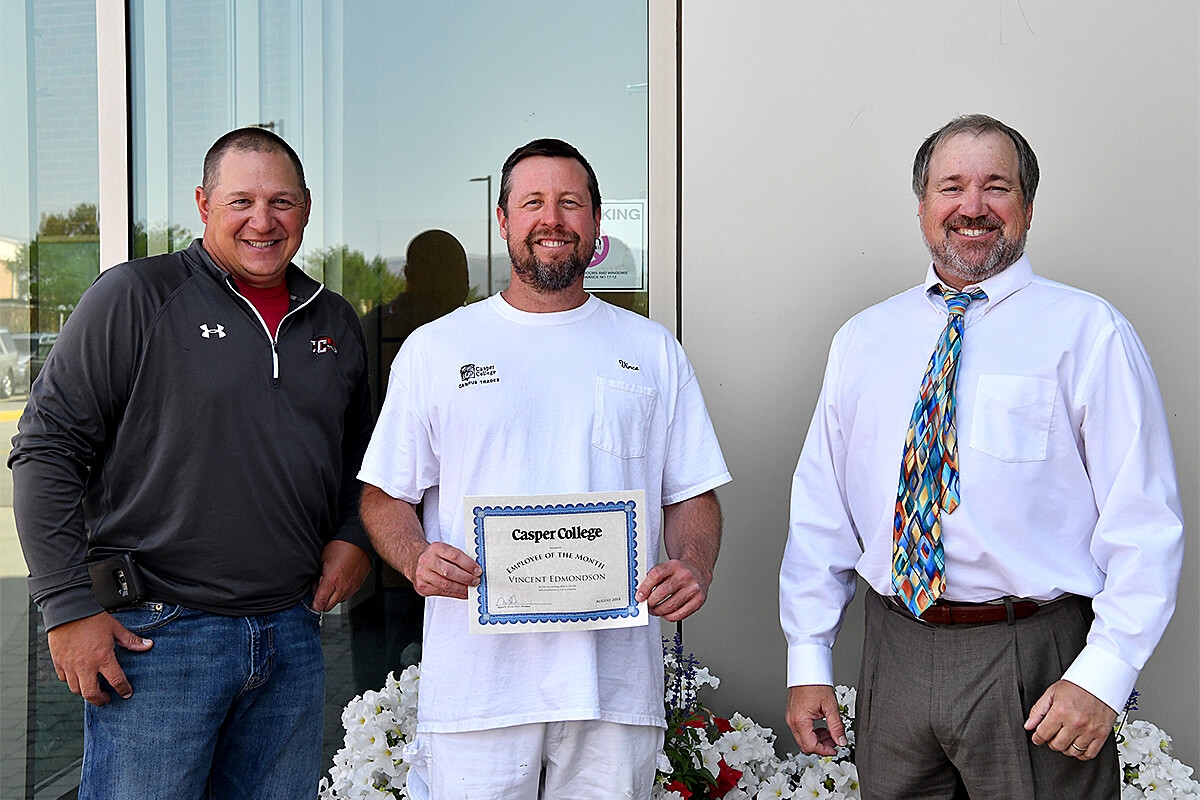 Photo of Vincent Edmondson center with Tom Popilek left and Darren Divine right.