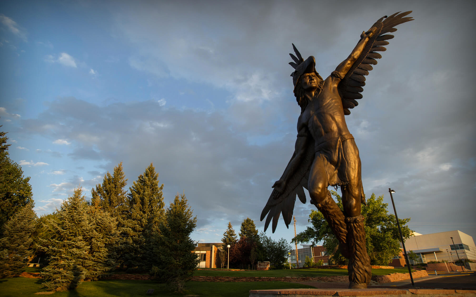 "Spirit of the Thunderbird," a bronze statue by alumnus and sculptor Chris Navarro, was inspired by CC's original Heyoka mascot costume.