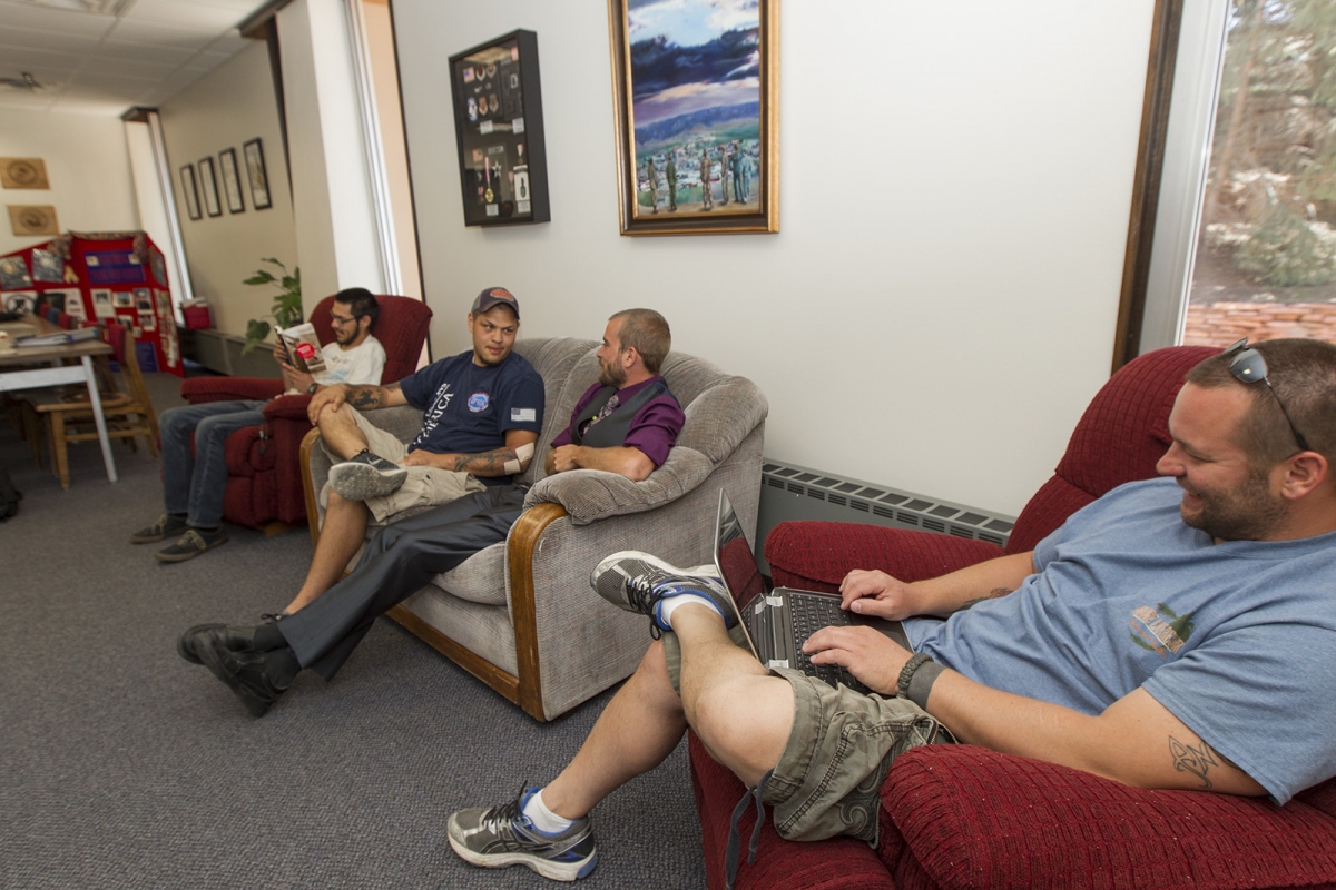 group of student veterans sitting on couches in the lounge