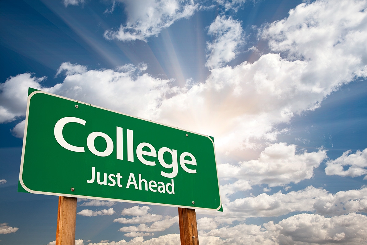 Photo of sign that says "College just ahead."