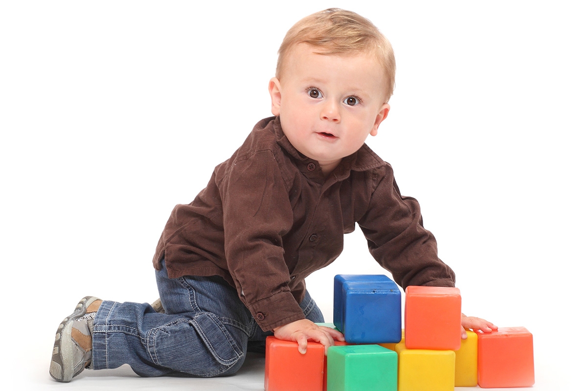 Photo of toddler playing with blocks.