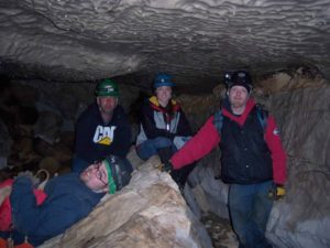 four college students inside a cave