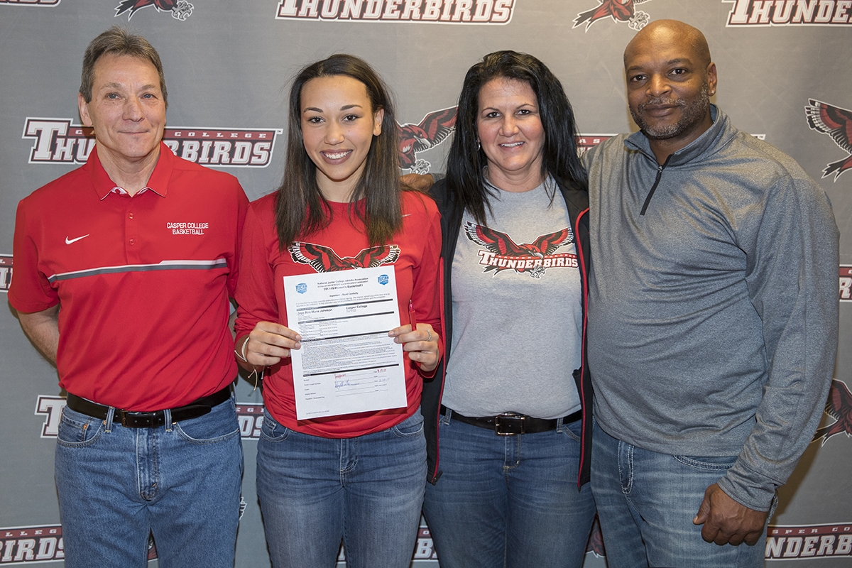 jayejohnsonsigningimage-041717 L-R: Head Coach Dwight Gunnare, Jaye Johnson, mom Suzie Williams and dad Phillip Johnson.