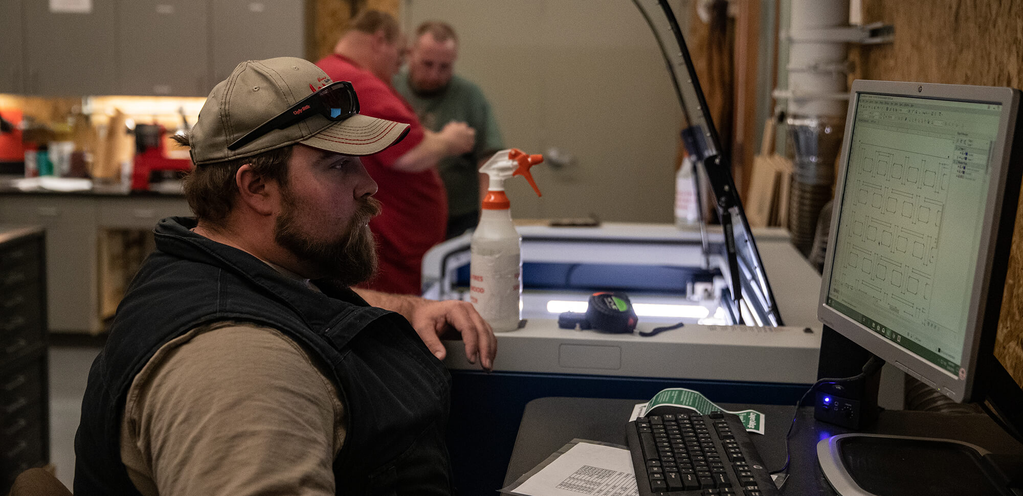 Photo of a student working with a 3-D printer.