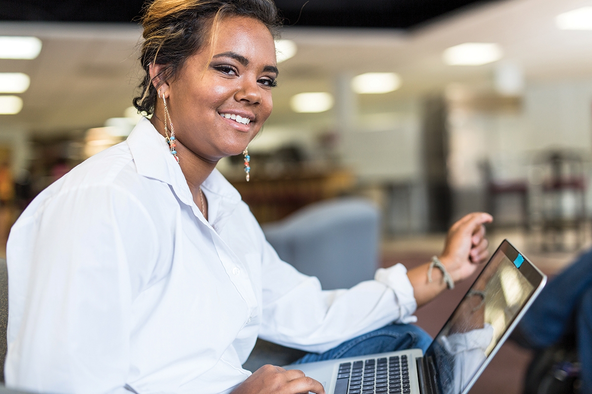 Photo of student with laptop computer