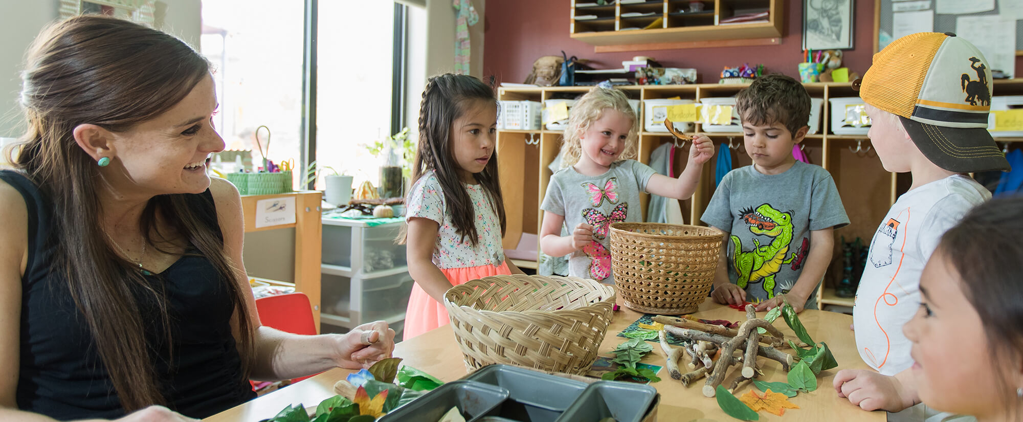 Photo of Casper College student in the early childhood education program working with children.