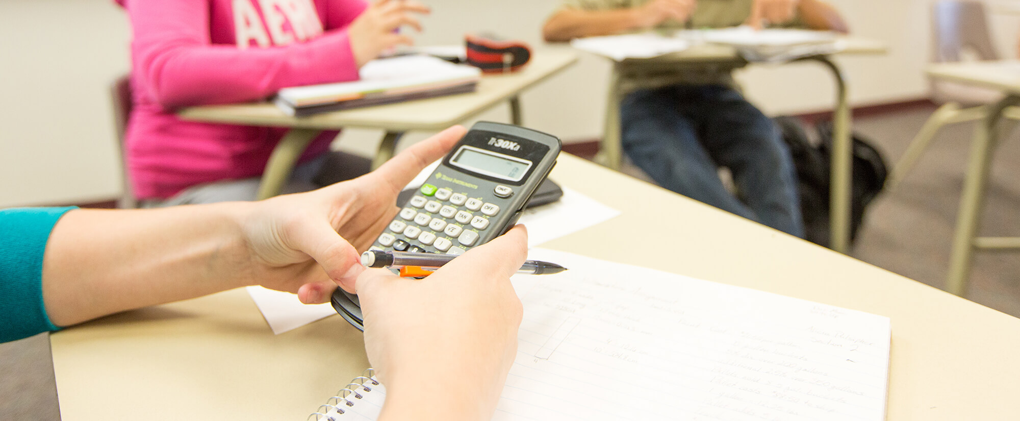 Photo of student using a calculator.