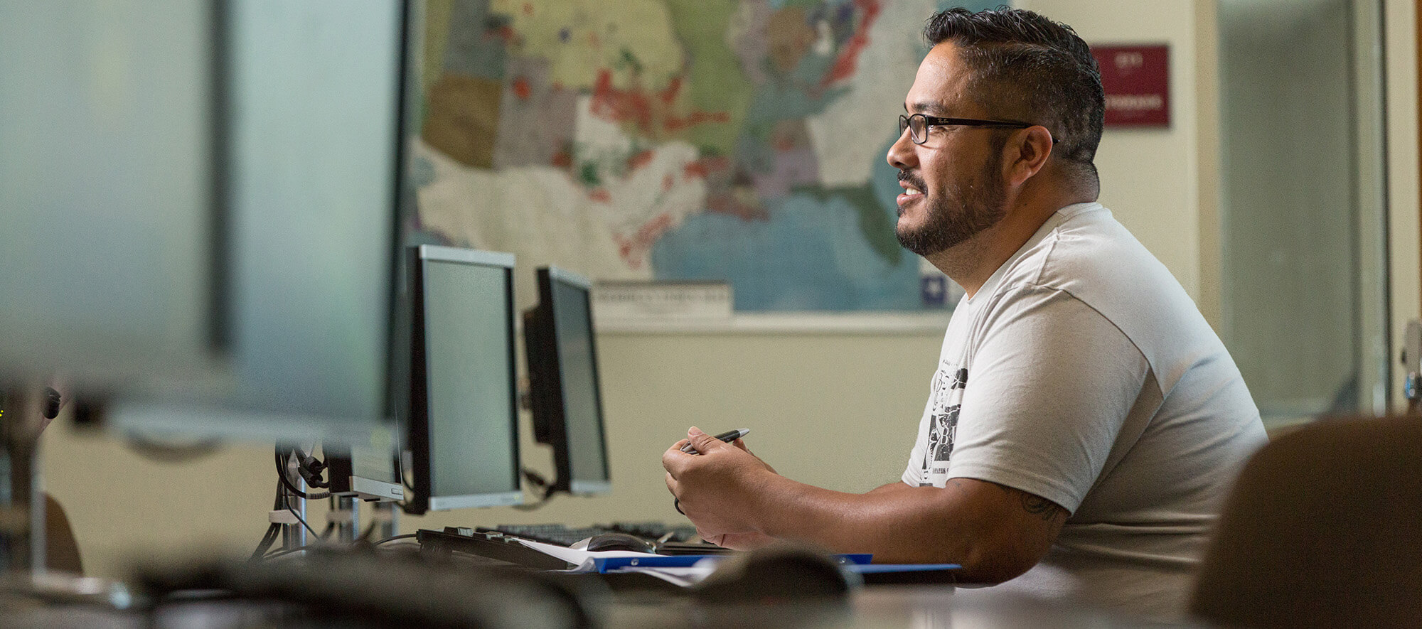 Student in front of a row of computers at Casper College.