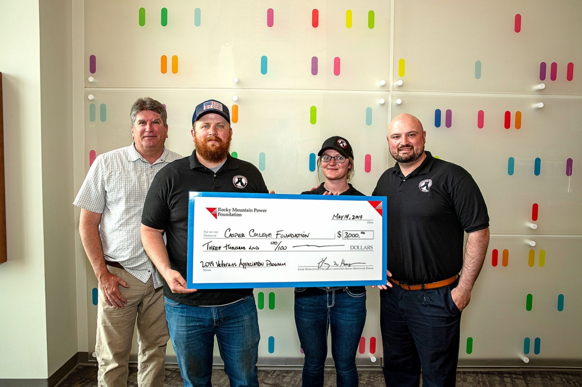 donationtoveteransclubimage Photo of Casper College Veterans Club receiving donation check.