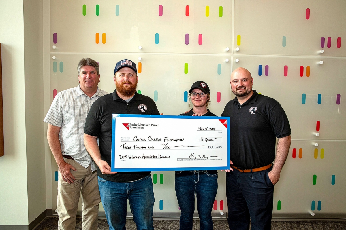 Photo of Casper College Veterans Club receiving donation check.