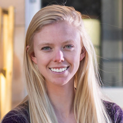 Casper College grad Shelby Whitman stands outside of a building at the University of Wyoming