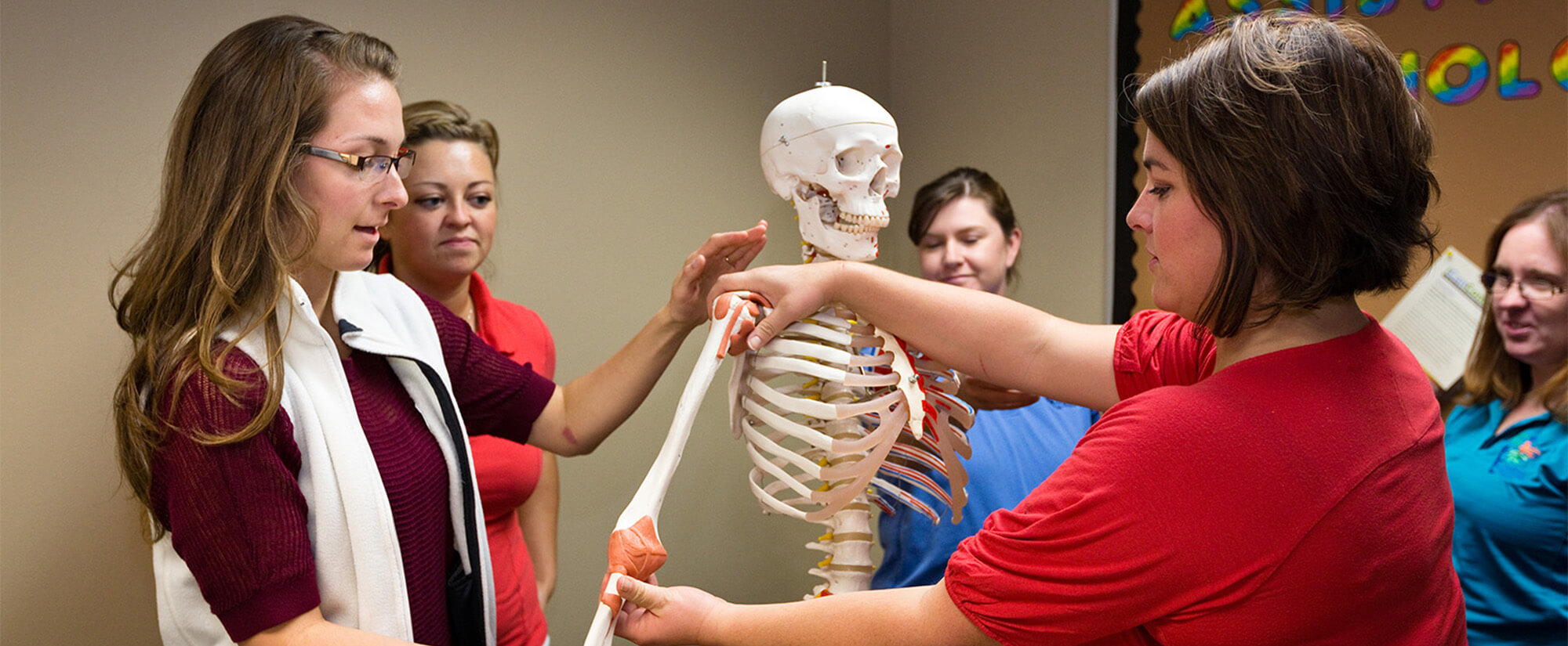 Photo of Casper College student in the early childood education program working with children.