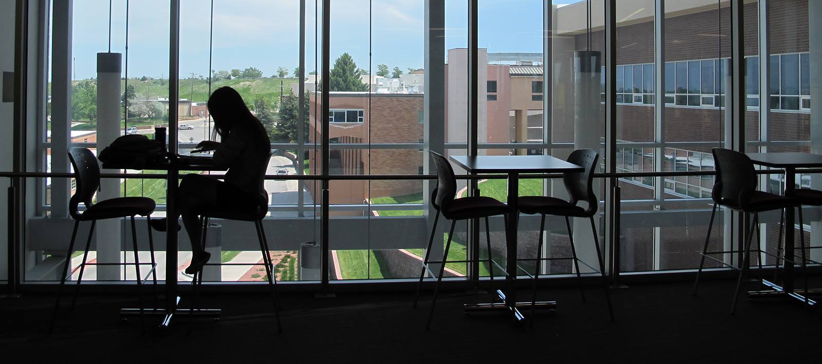 photo of a student studying, backlit