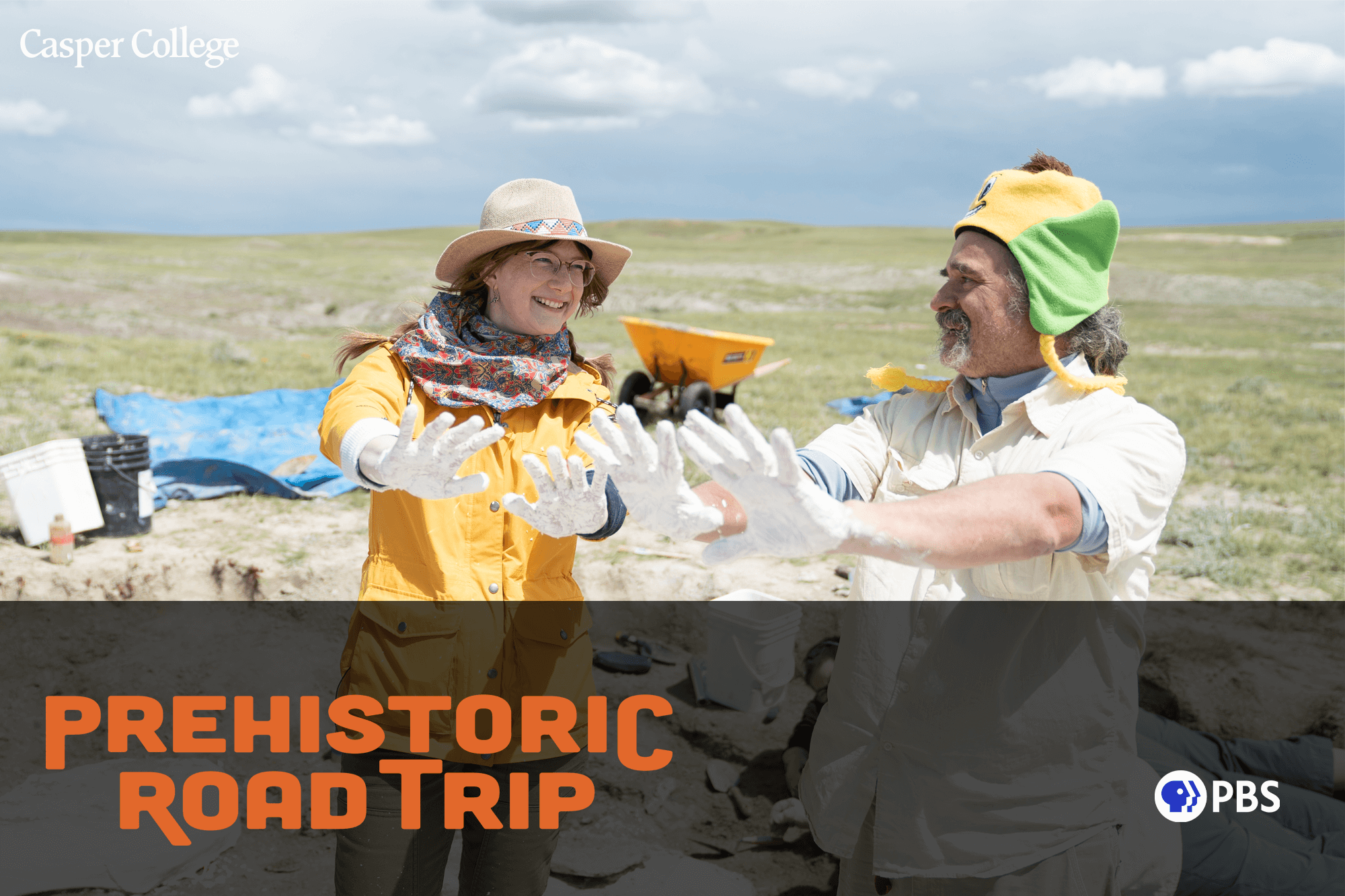 Photograph of two people at a dinosaur dig site with the words "Prehistoric Road Trip."