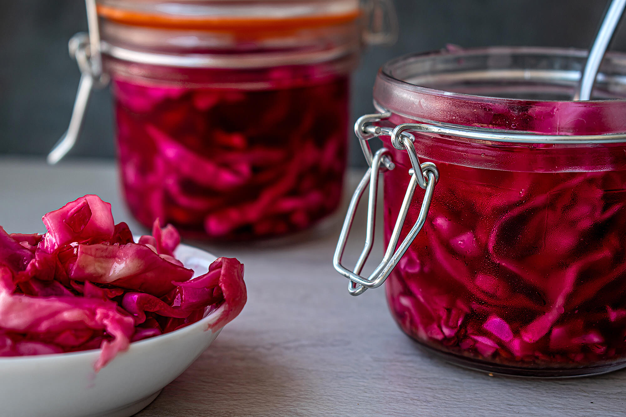 Photo of pickled beets in glass jars.