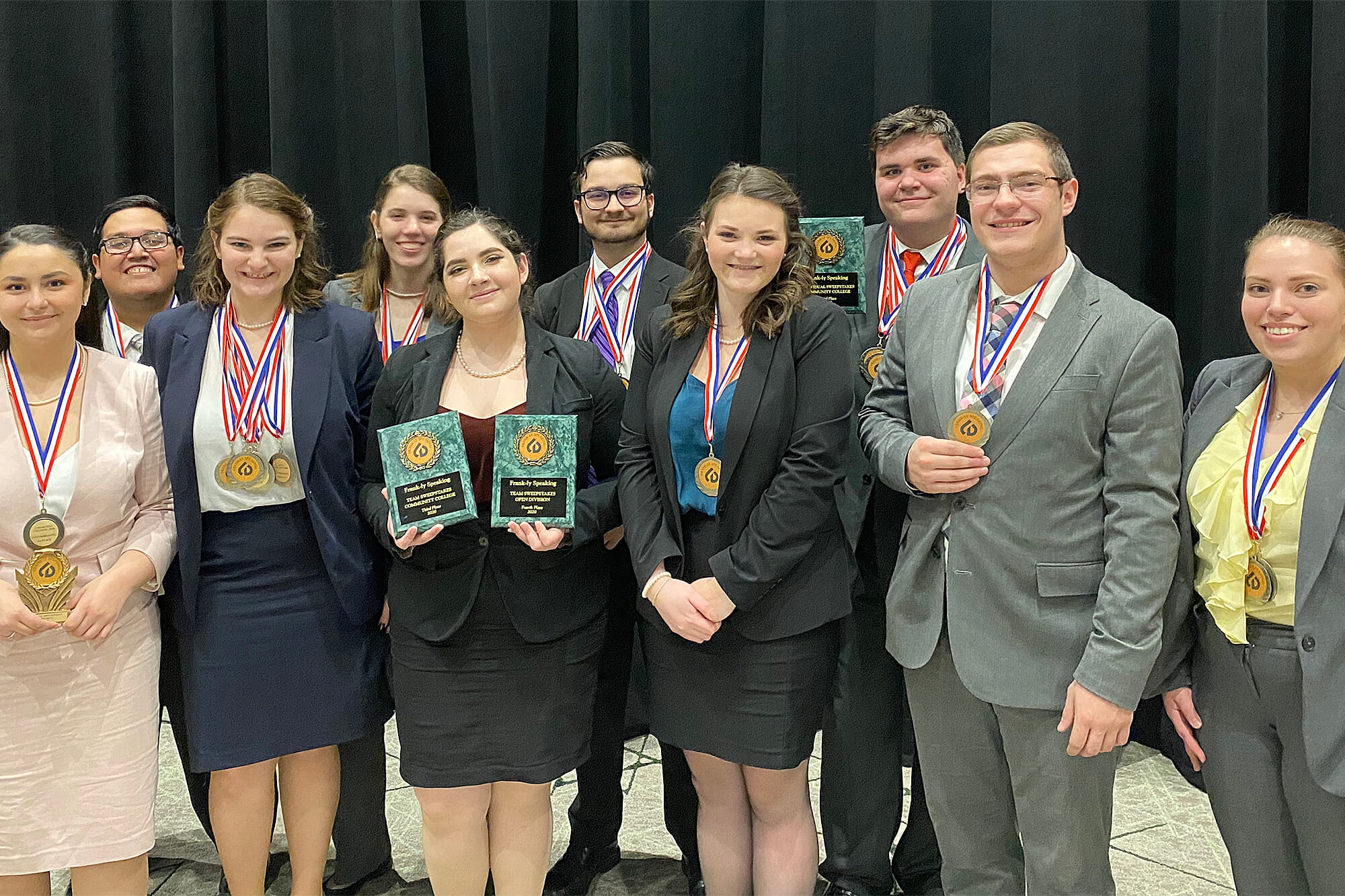 Photograph of debate teams with awards from DuPage College debate tournament.