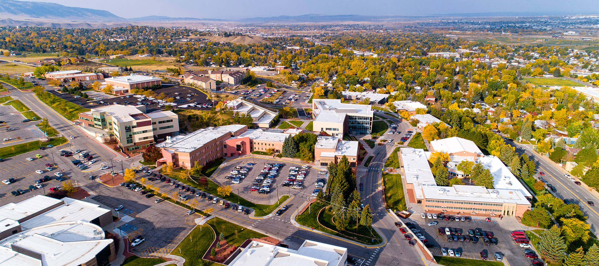 casper-college-campus-fall-scenic-wyoming Aerial view of campus buildings with trees turning colors in the background