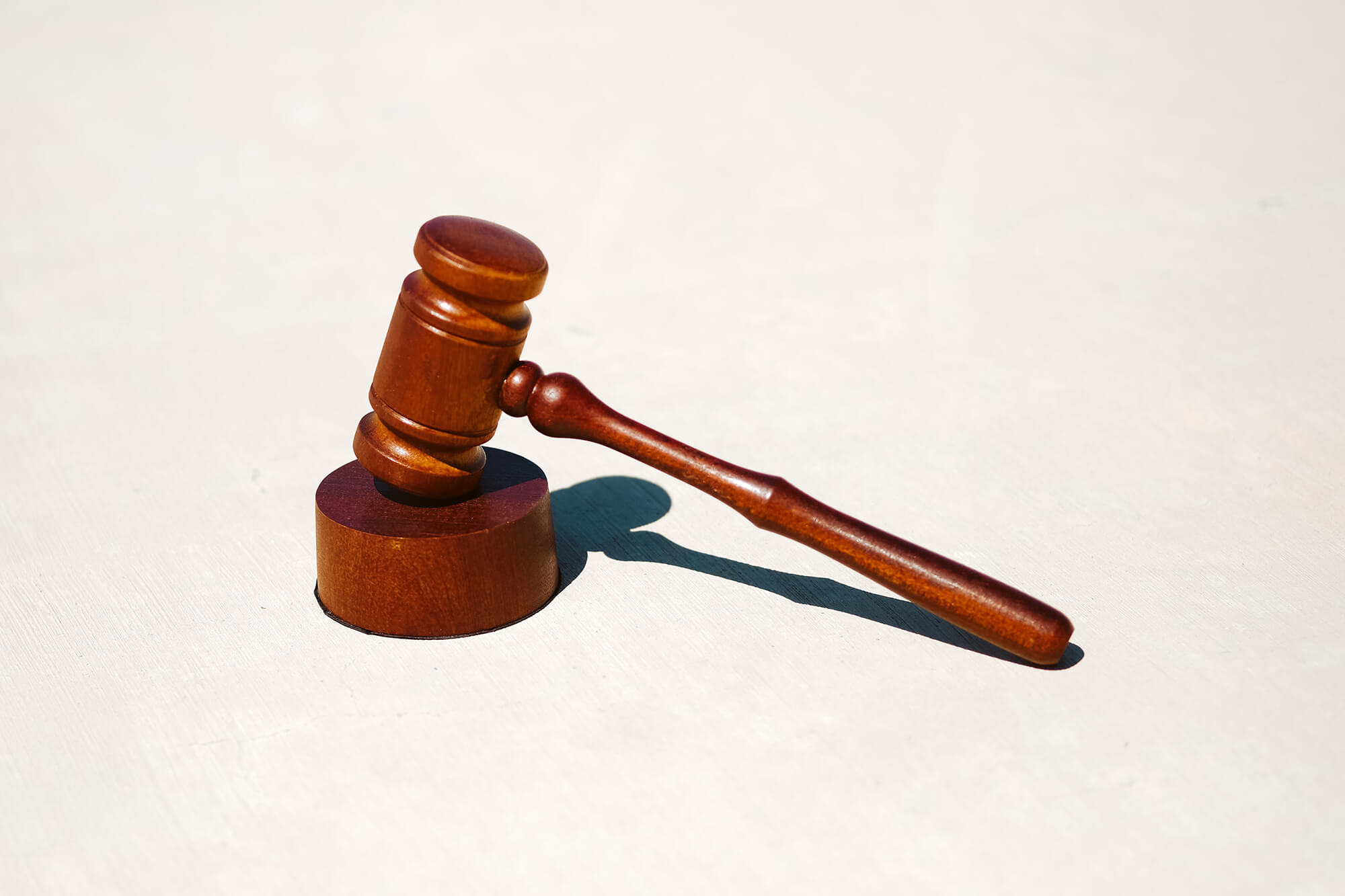 A photo of a wood gavel against a white background.