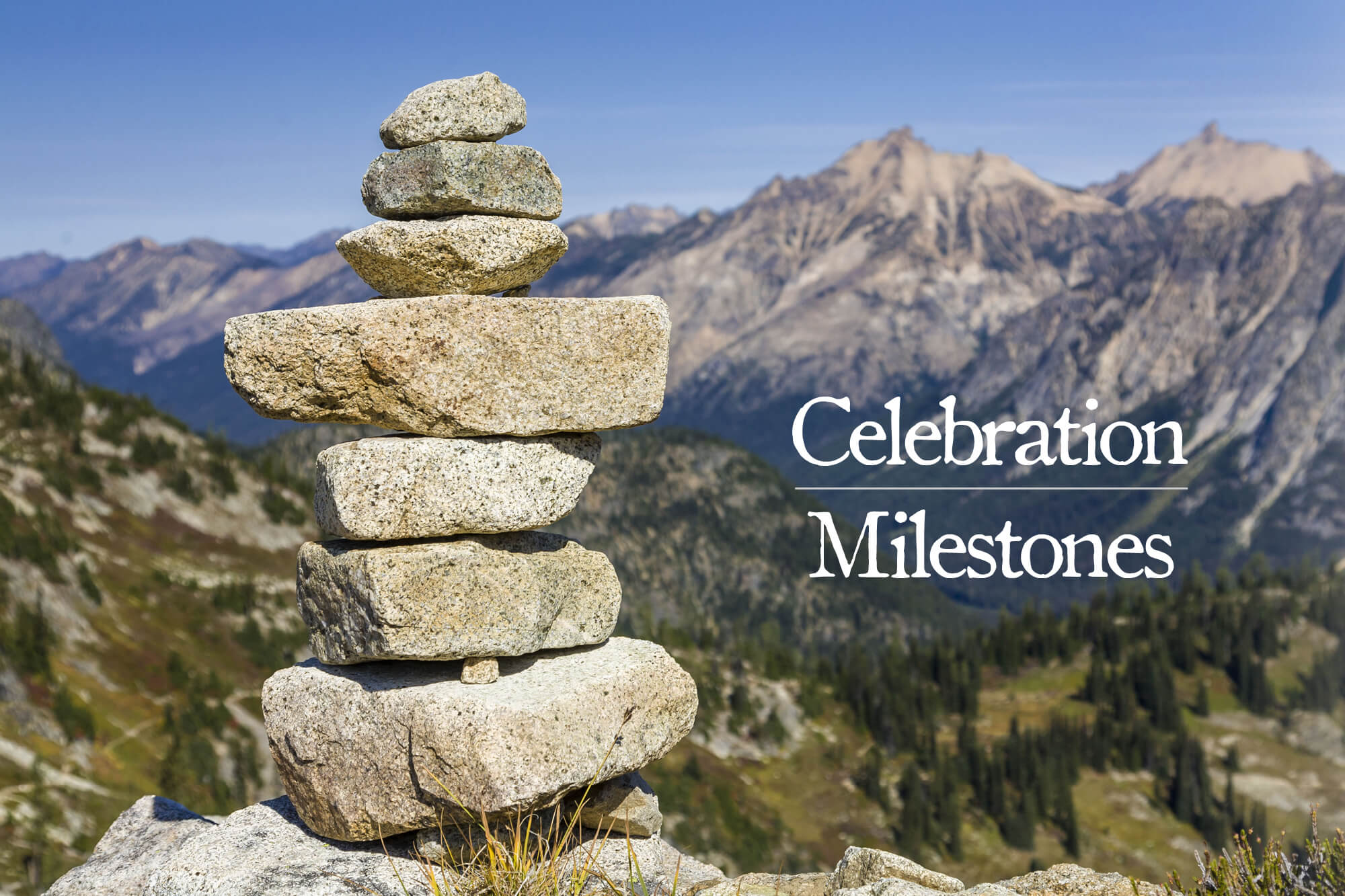 Photo of a stack of boulders with a mountain in the background with the words "Celebration Milestones."