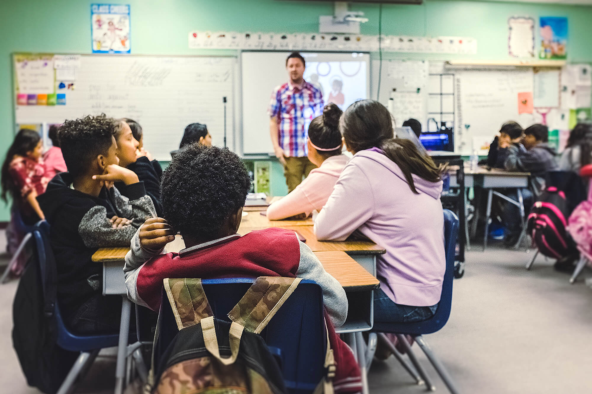 Photo of a classroom of students and a teacher.