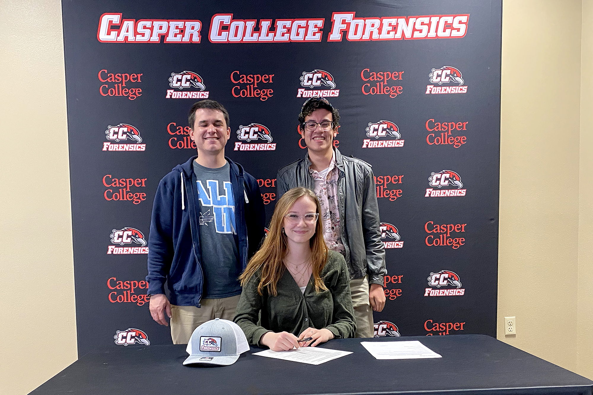ForensicTeamSignsCheyenneDebatersImage–0521 Photo of (l-r) Marcus Viney, Emma Rudell, and Jayden Roccaforte.