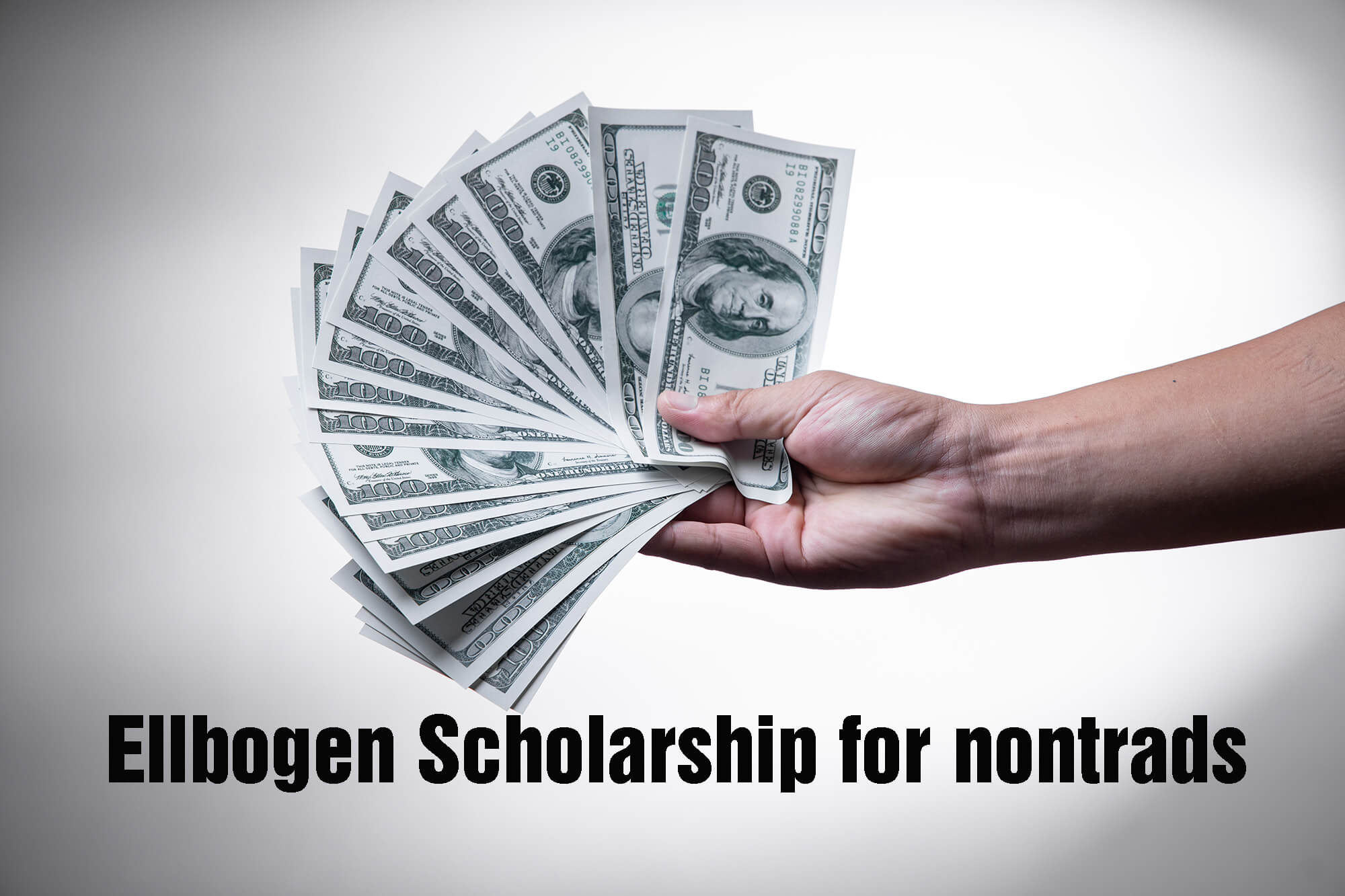 Photo of money in a person's had for the Ellbogen Scholarship press release
