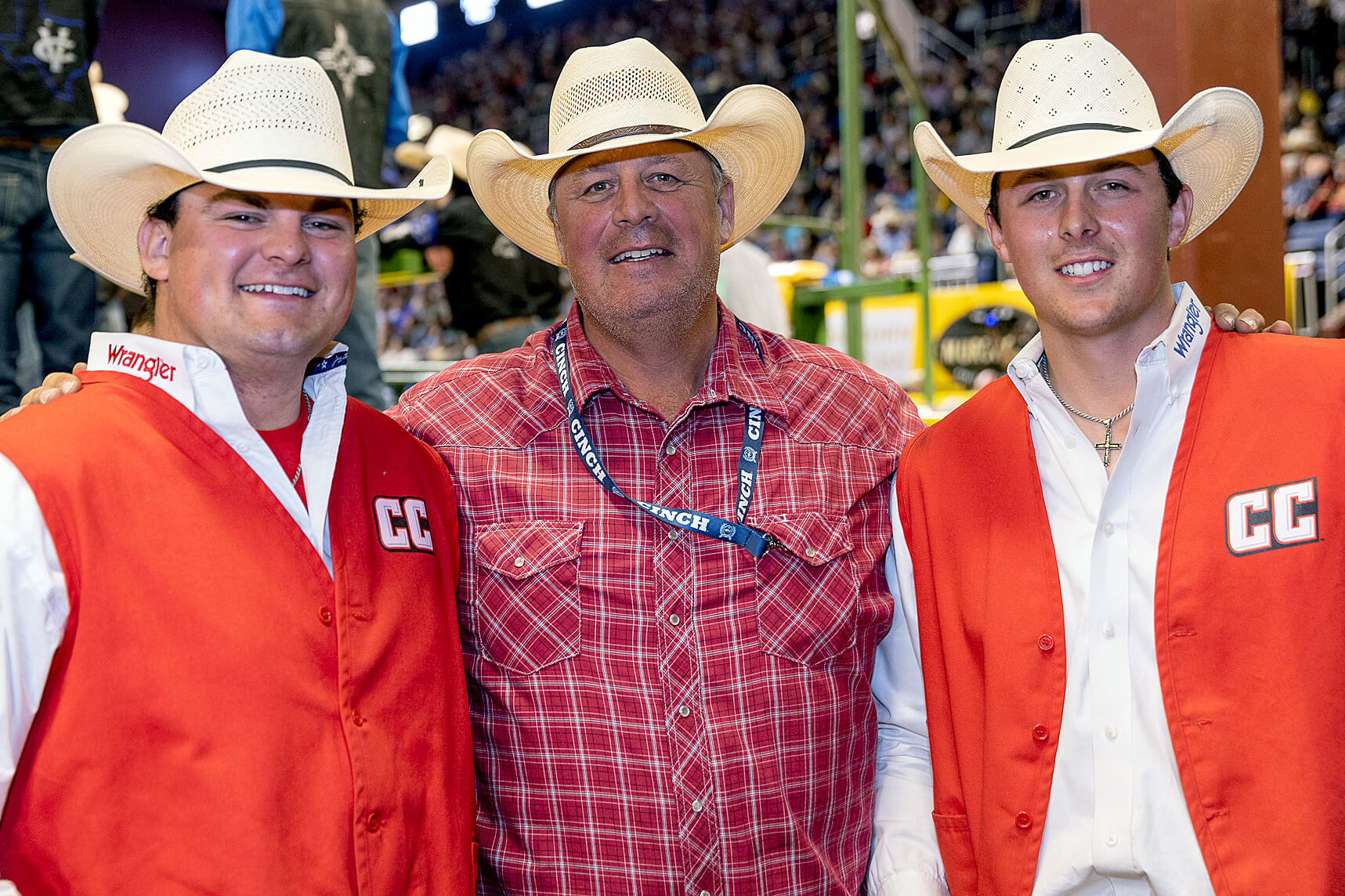 Championship photo of CC Rodeo Team members Kellan and Carson Johnson with head coach and dad Jhett Johnson.