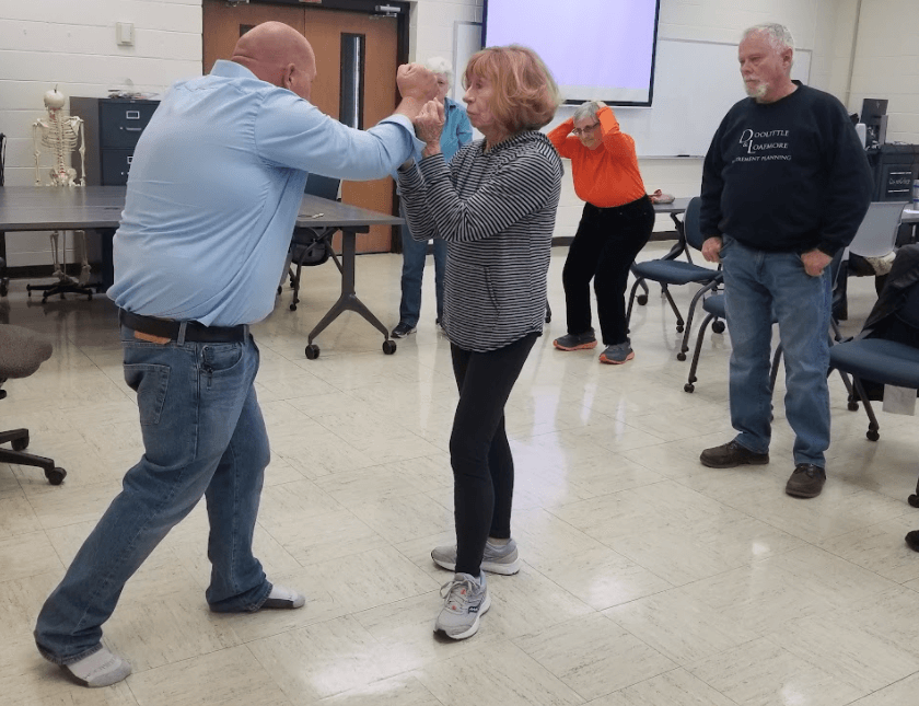 adults practice self defence moves