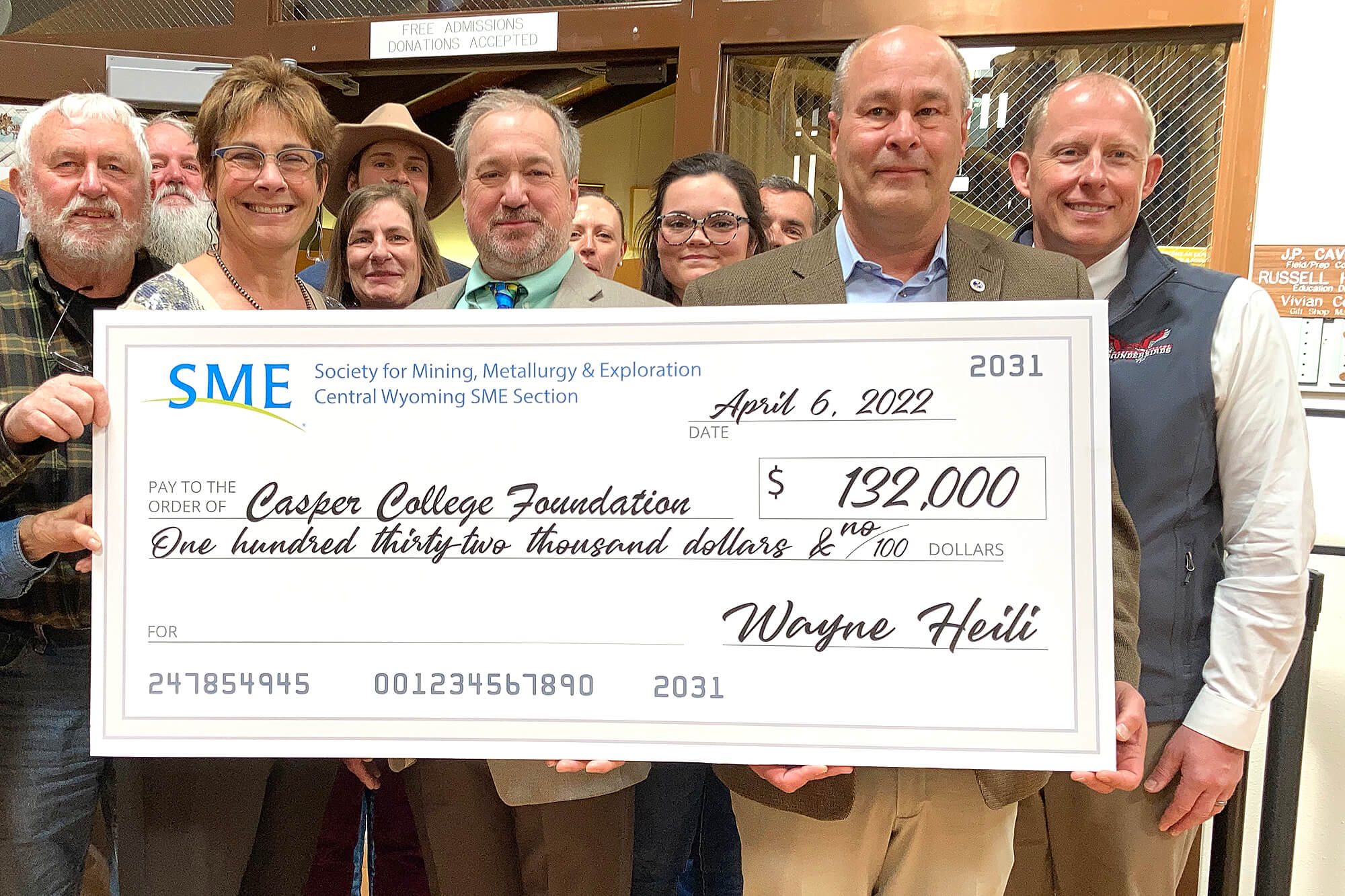 Photo of giant check from SME to Casper College.