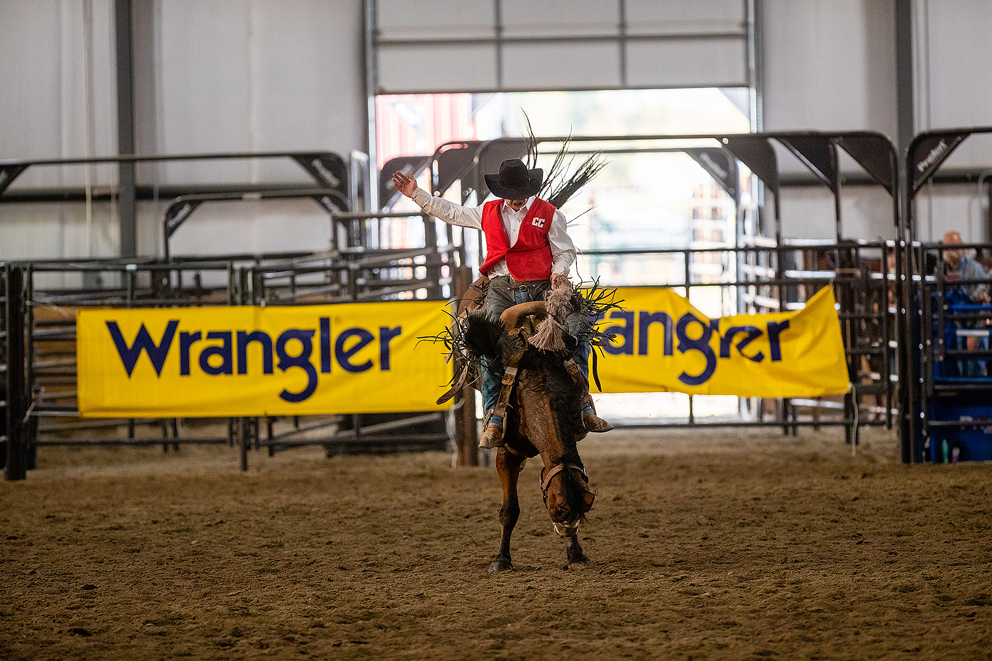 Photo of a man on a bucking bronco.