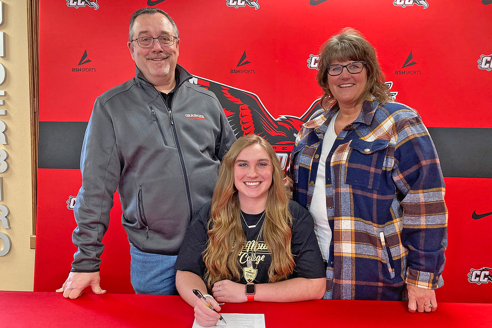 Photo of Hannah Trumbull, women's soccer player, and her parents Willy and Christine Trumbull.