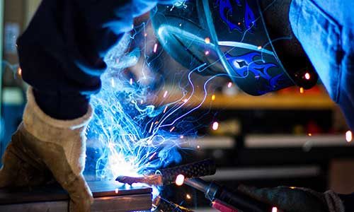 close up shot of person welding