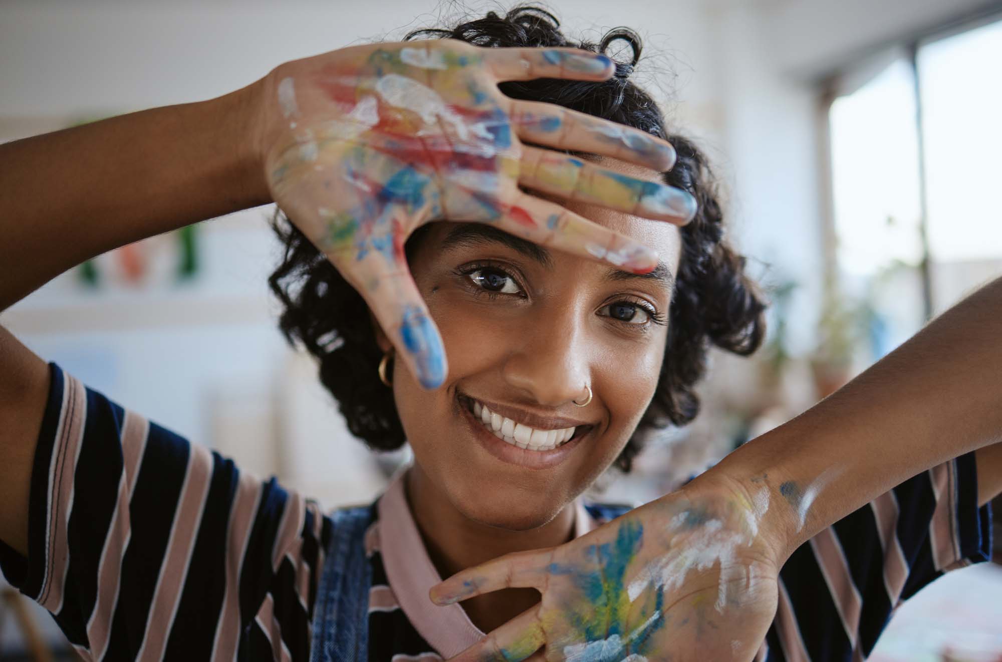 A female student focuses on drawing in a sketchbook