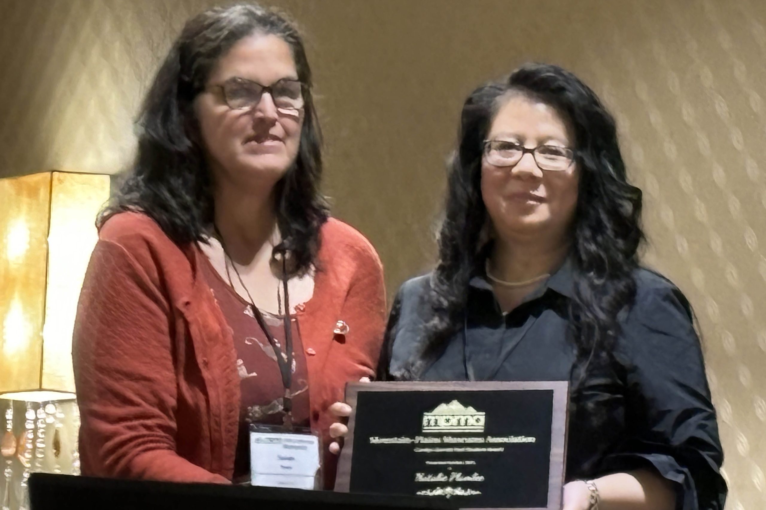 Natalie Plumlee receiving her award at the MPMA Conference.