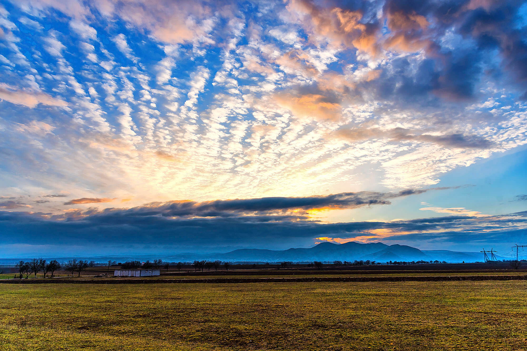 ConcertBandImage–0525 Photo of a sunset through clouds for CC Concert Band press release.