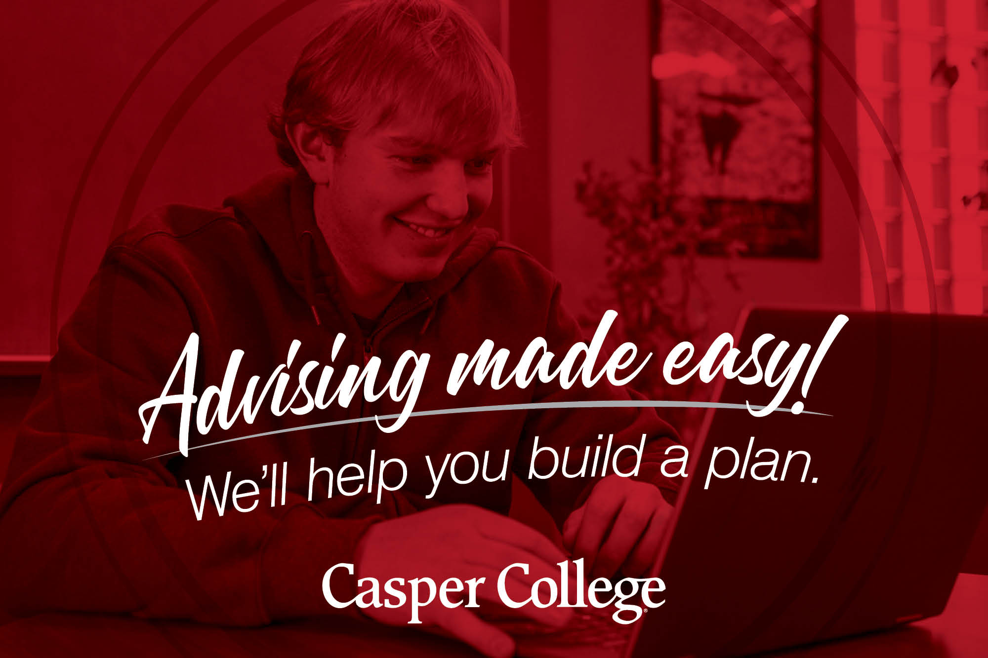 Dark red and black image showing a male student in the background with his laptop and the words "Advising made easy! We'll help you build a plan" with the Casper College logo at the bottom.