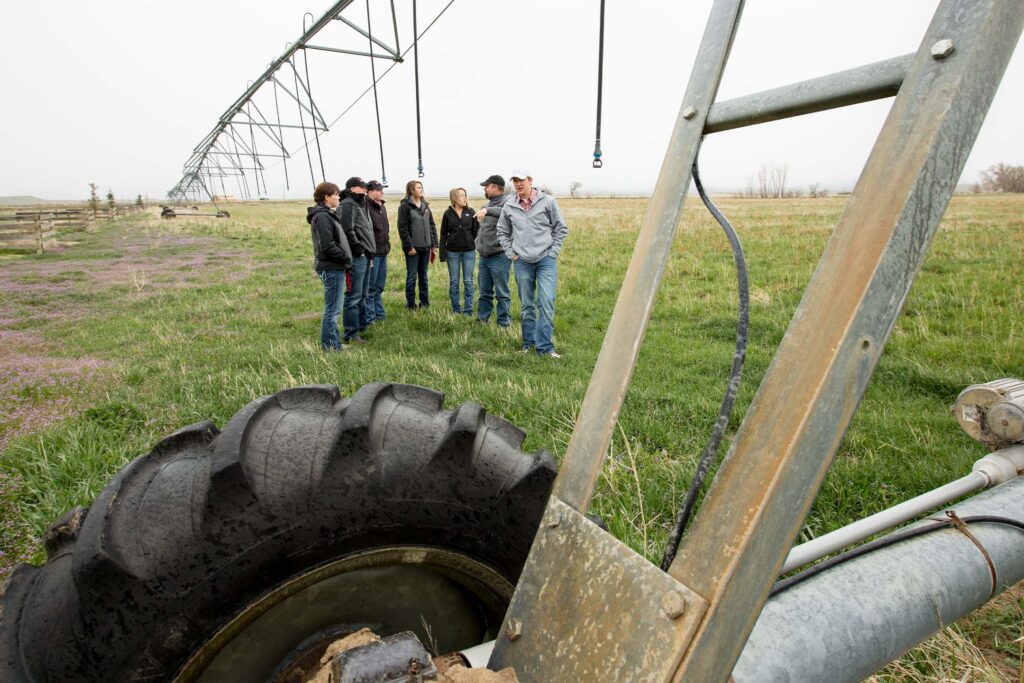 Students learn about irrigation systems and grazing management during a field visit to working rangeland.