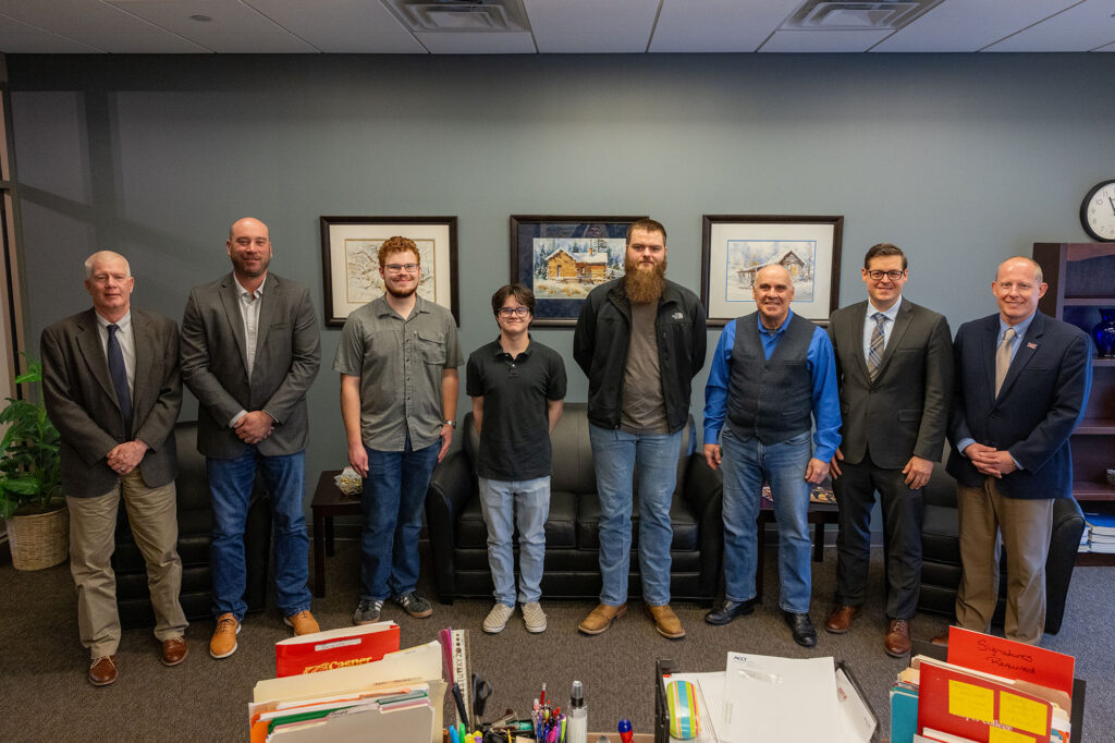 Pictured L-R: Jerry Hawks, Ph.D., Vice President Academic Affairs for Casper College; Jeff Sun, Dean, Casper College School of Science; Casper College students Ethan Green, Mechanical Engineering, Samson Peterson, Metallurgical Engineering, and Nolan Goulart, Metallurgical Engineering; Paul Marquard, Ed.D., Casper College Engineering Instructor; Brian Tande, Ph.D., South Dakota School of Mines and Technology President; Brandon Kosine, Ph.D., Casper College President.