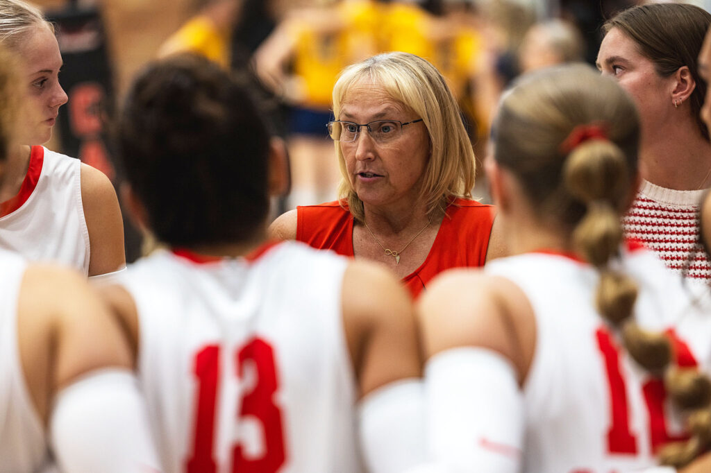 Photo of CC Volleyball head coach Angel Sharman talking to the team during their match against Western Nebraska Community College Sept. 2, 2025 in the "Swede" Erickson Thunderbird Gym. (Casper College photo)