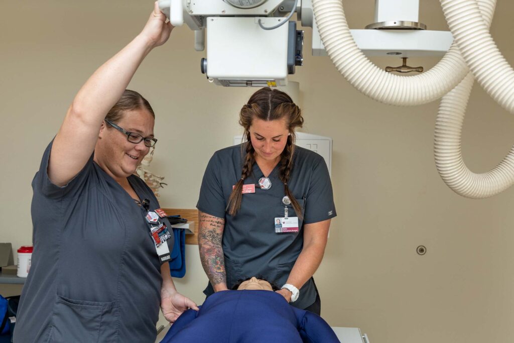 Students preforming an X-Ray for their radiography class