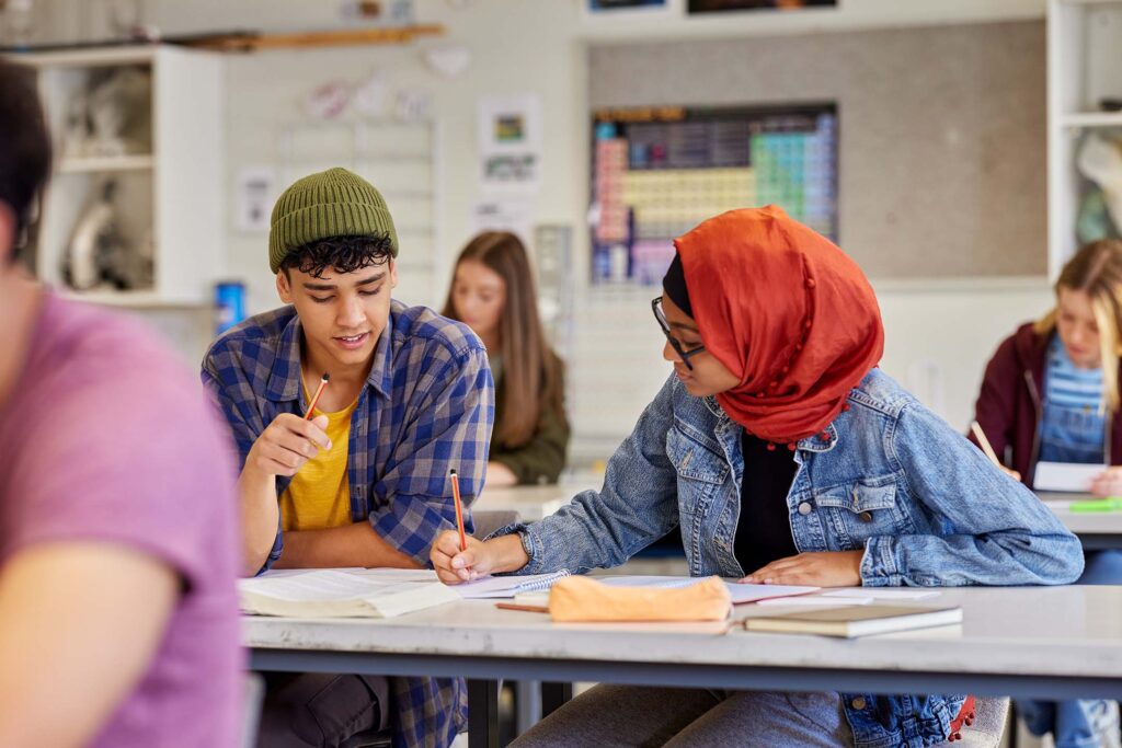 Diverse group of students collaborating in a classroom. international studies