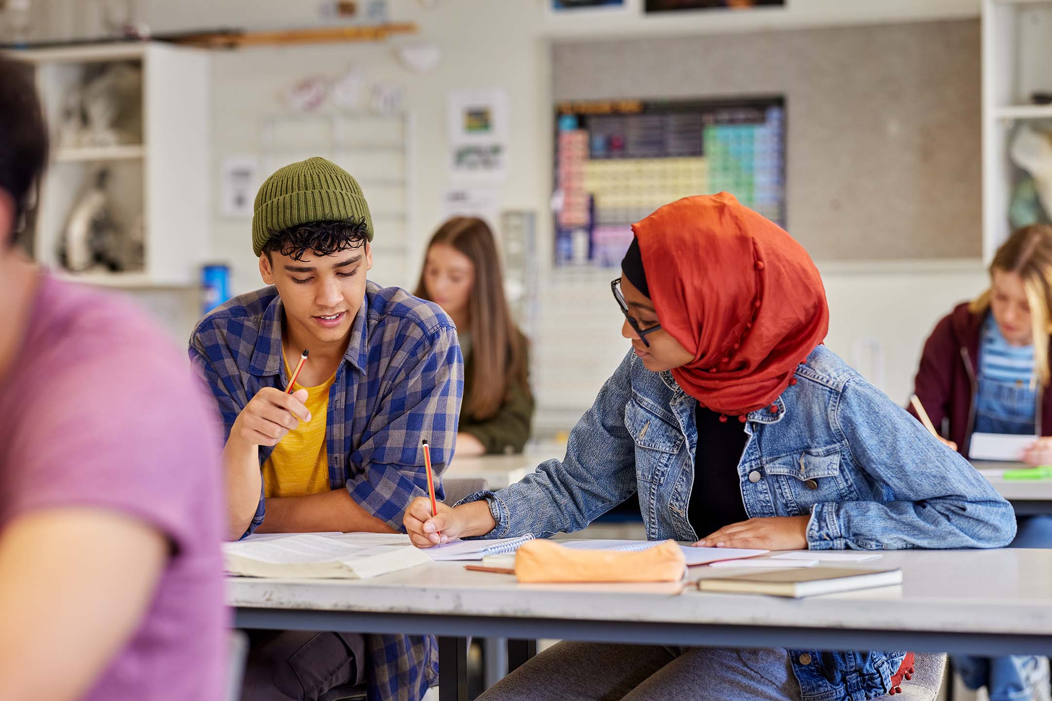 Diverse group of students collaborating in a classroom. international studies