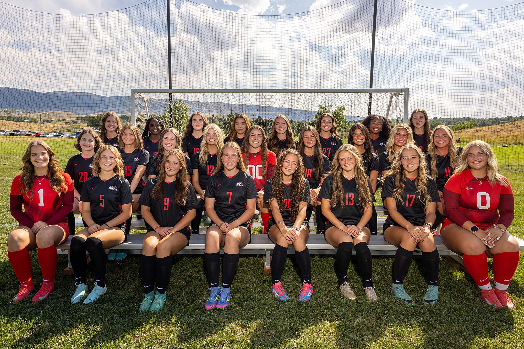 womens-soccer-season-results-image-0626 Casper College women's soccer team portrait on the field in front of a soccer net.