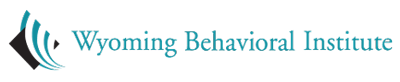 Wyoming Behavioral Institute logo with a teal and gray abstract leaf design beside the organization name.