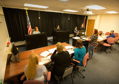 Students act out a courtroom scene as part of the paralegal program.